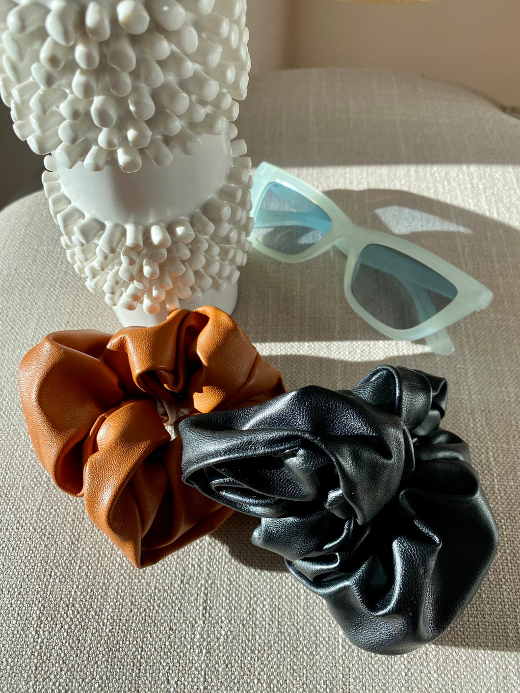 Camel or black faux leather scrunchie. A must have Hair accessory.