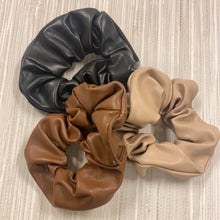 Load image into Gallery viewer, Camel or black faux leather scrunchie. A must have Hair accessory.
